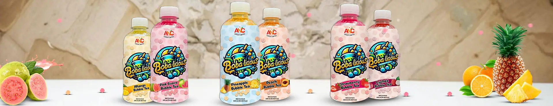 Bobalicious 320ml bubble tea bottles in six fruity flavours, displayed with vibrant fruits and popping boba on a light background.